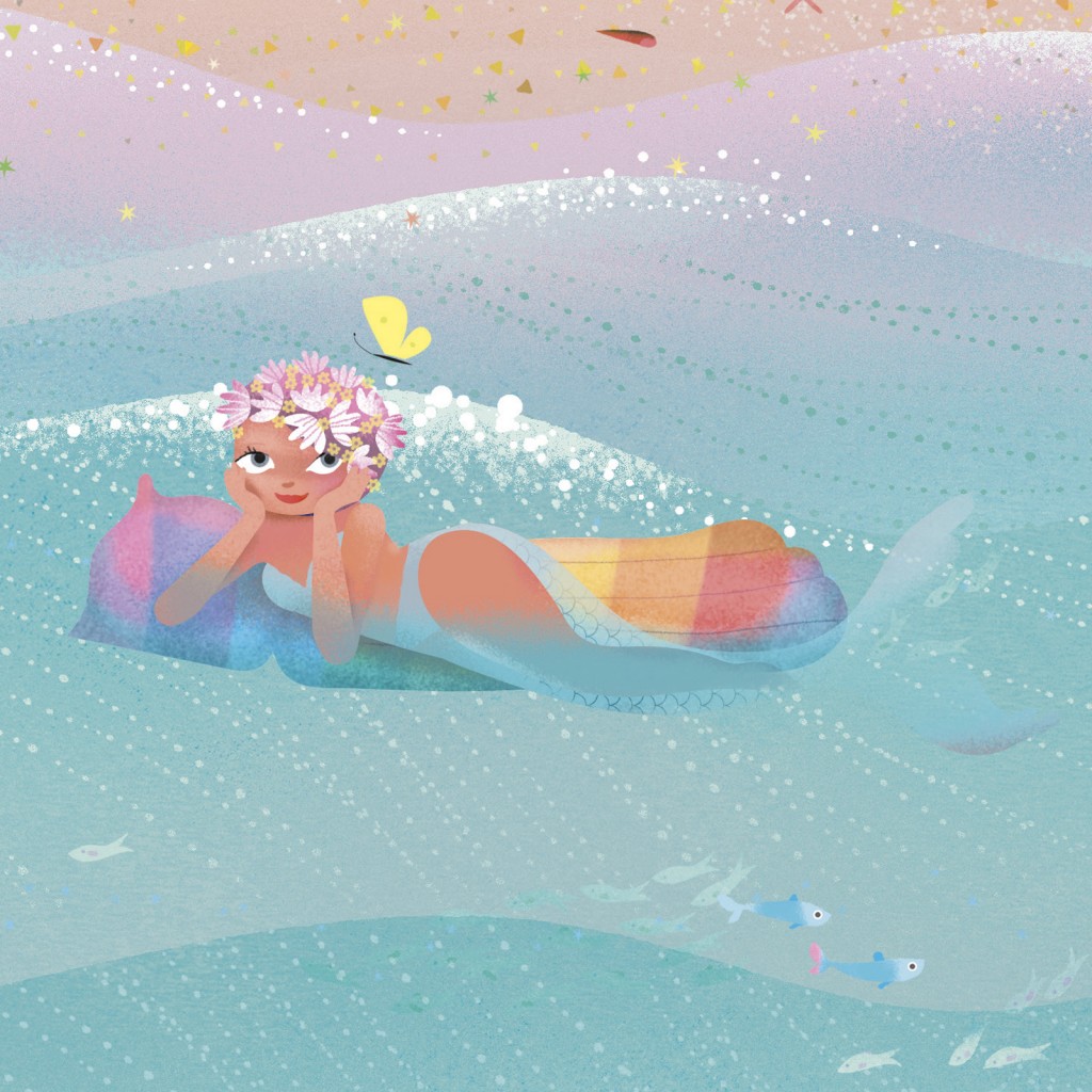 A mermaid laying on an inflatable matress