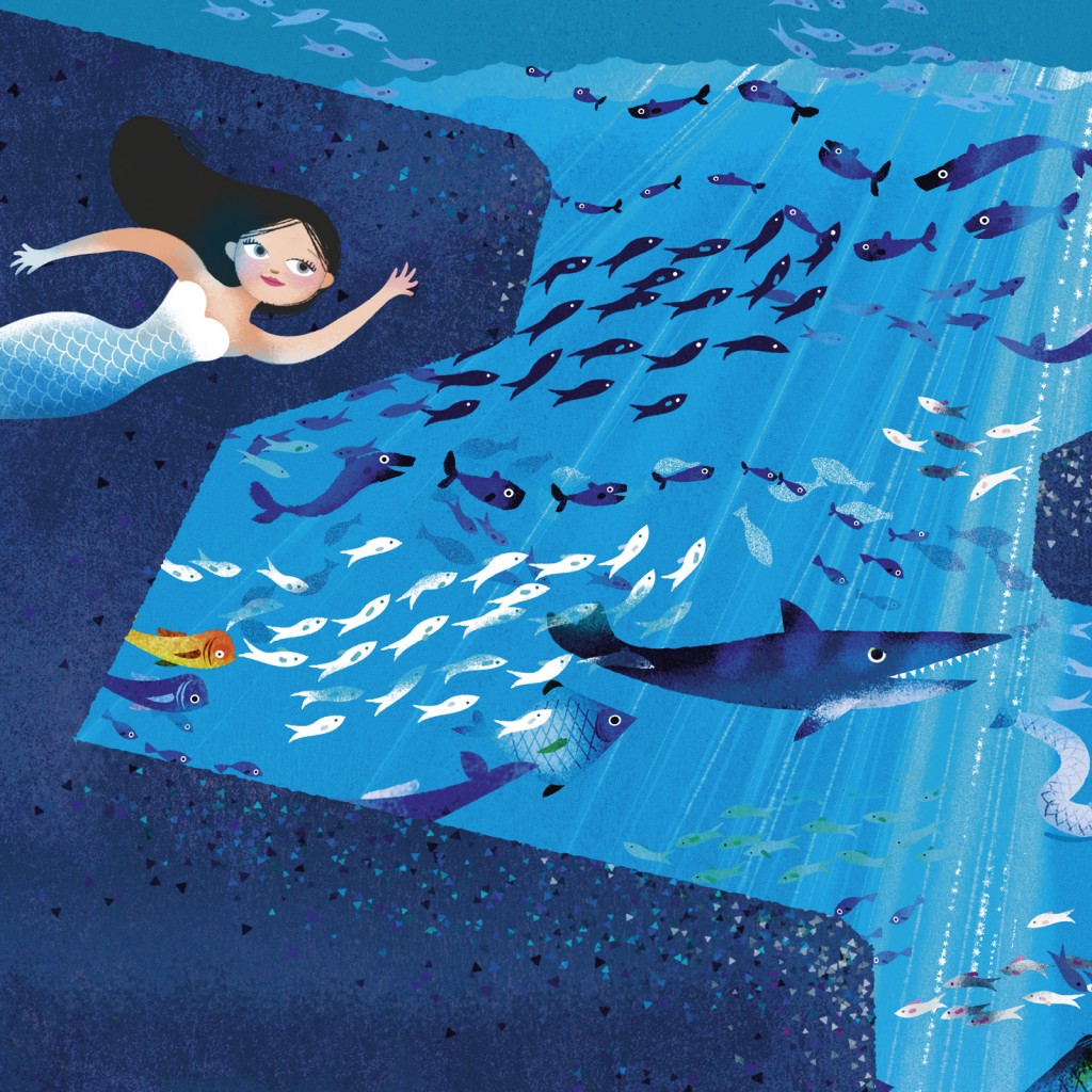 A mermaid swimming with fish